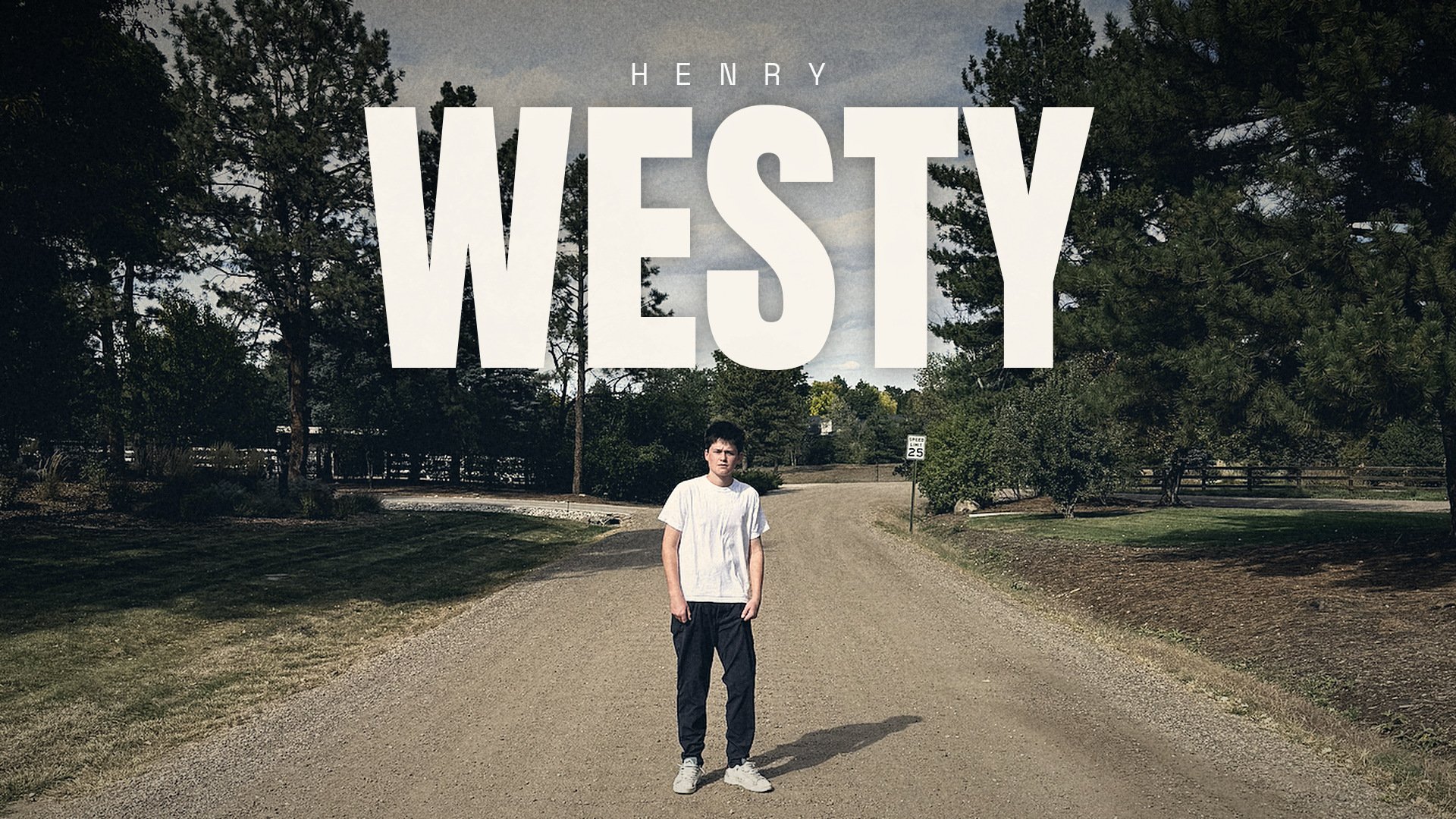 HENRY WESTY lettering across the sky above Henry standing on a gravel road